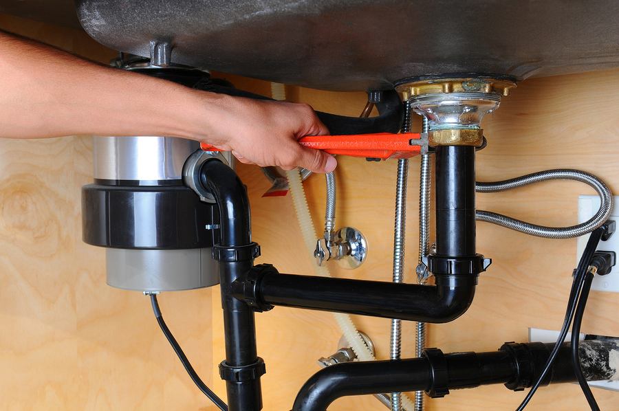 How to Unclog a Garbage Disposal With Standing Water